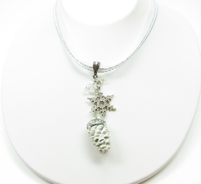Necklace with White Pine Cone and Silver Snowflake Charm