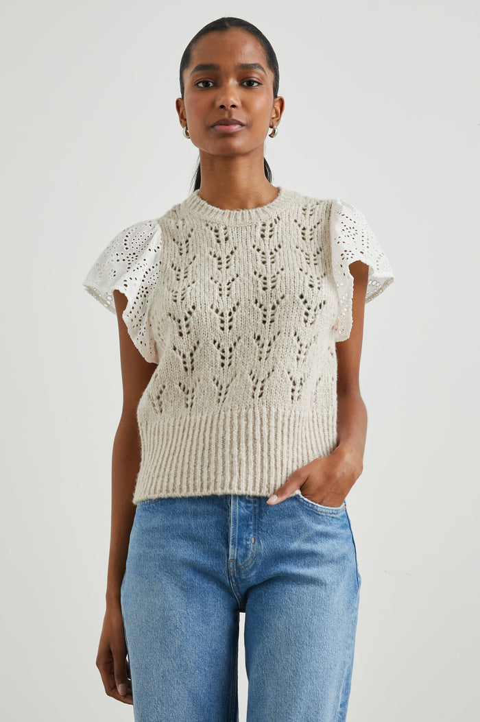 Everly Top with a Knit Bodice with Ribbed Trim and a Crew Neck and White Cotton Short Sleeves with Eyelets In Oat Colorway - Front View Featured on Model