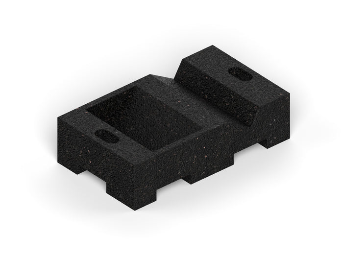 Black textured small leveling block with recessed center and angled support for stabilizing wooden playset legs.