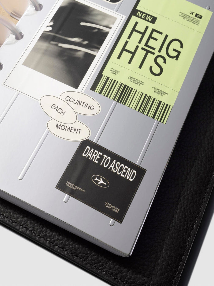 Closeup of dashboard in a black leather planner displayed on a neutral background. Size shown is HP Mini.