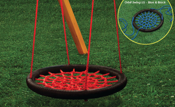Orbit Swing Large with red woven surface and black heavy-duty ring hanging from swing set on grass