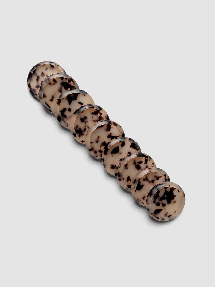 Plastic Planner Discs in the pattern Desert Tortoiseshell shown in 1" Inch sizing.