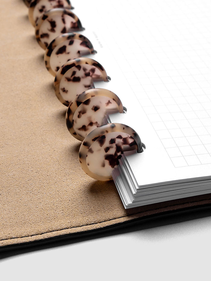 1" Inch Desert Tortoiseshell Planner Discs shown in use as binding with planner inserts.
