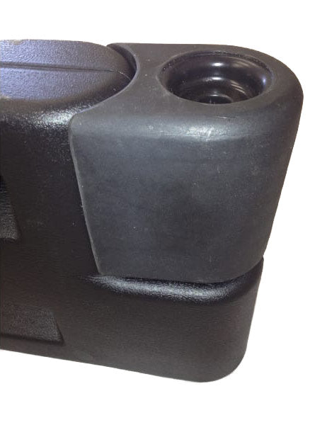 Black plastic playground border filler end cap with rounded edges and recessed hole for secure attachment
