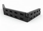 Black Plastic Playground Border with Spike edging wood chip and grass, durable lightweight retaining system with hollow rectangular cutouts