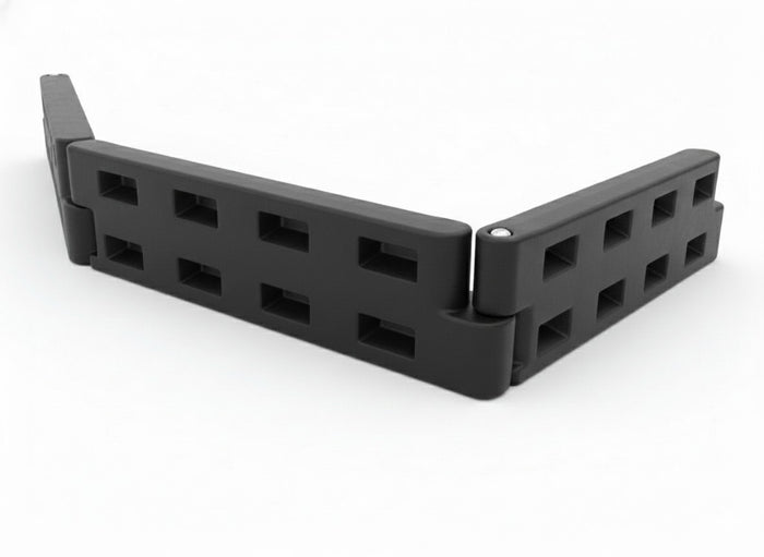 Black Plastic Playground Border with Spike edging wood chip and grass, durable lightweight retaining system with hollow rectangular cutouts