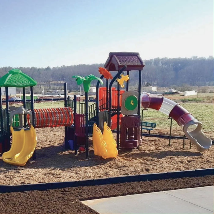 Durable black plastic playground border with spike enclosing colorful children's play structure with slides and climbing features