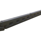 Dark gray interlocking plastic playground border with rectangular cutouts and connecting joints, angled view
