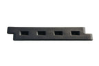 Black plastic playground border with four rectangular slots and a spike attachment, angled side view