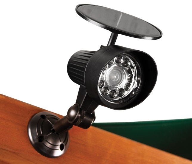 Playset Solar Spot Light with 12 LED bulbs, black adjustable mount on wooden outdoor swing set, solar-powered motion-activated light