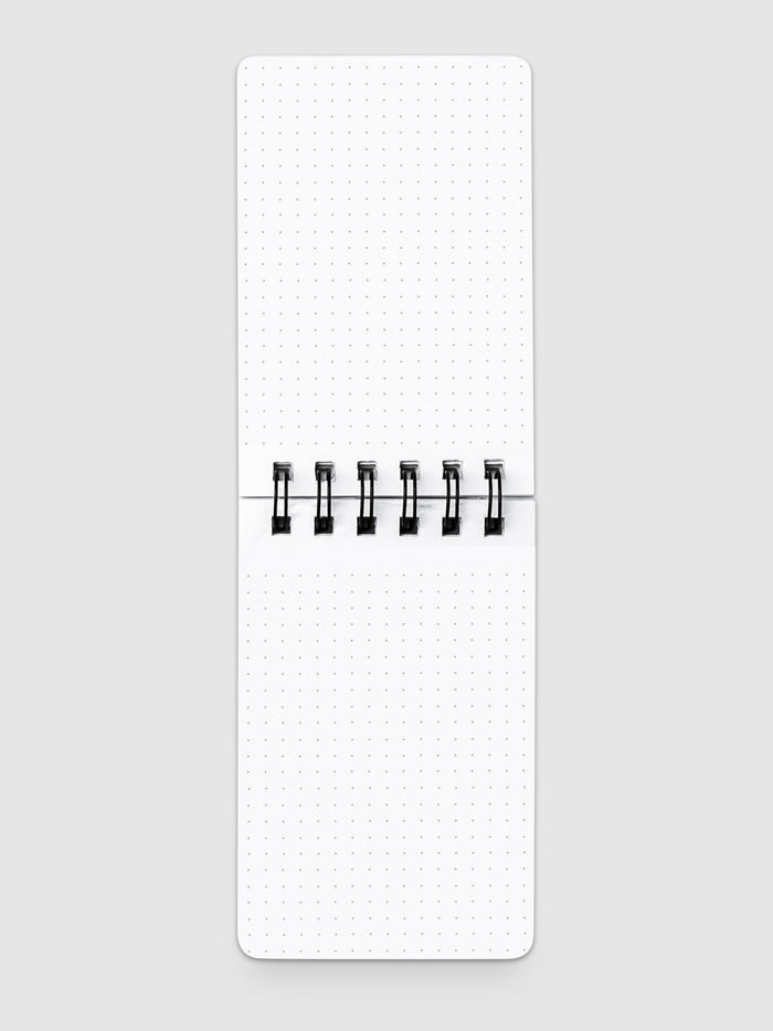 Reporter notepad open on a neutral background.