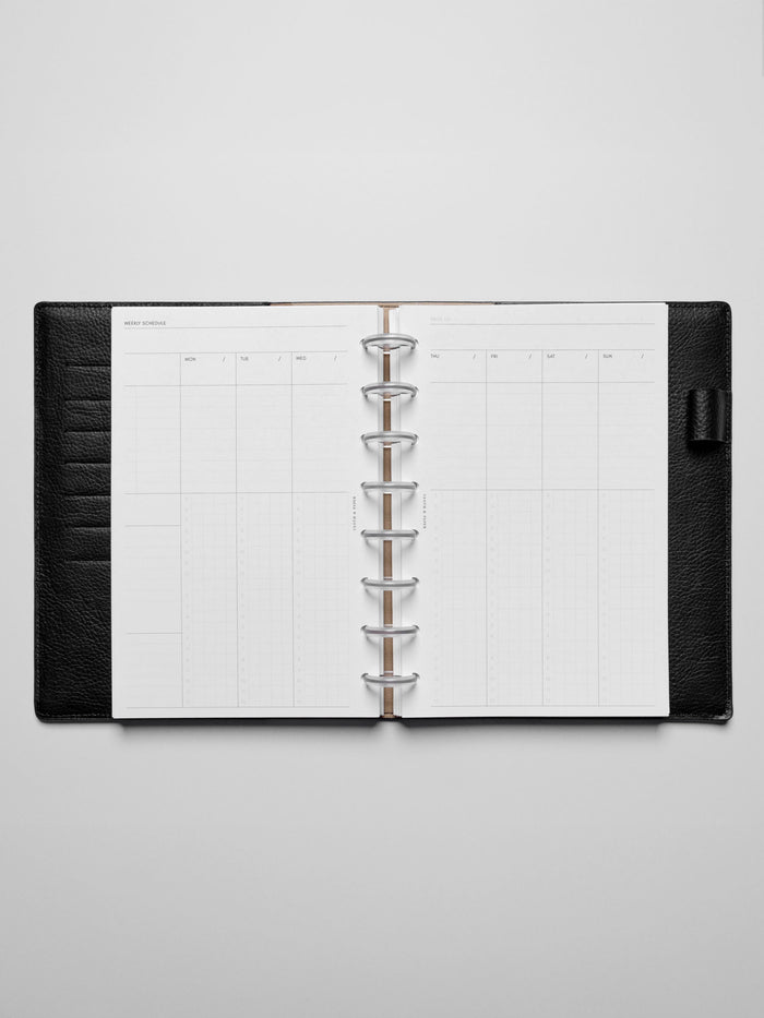 Insert in use inside a black leather planner.